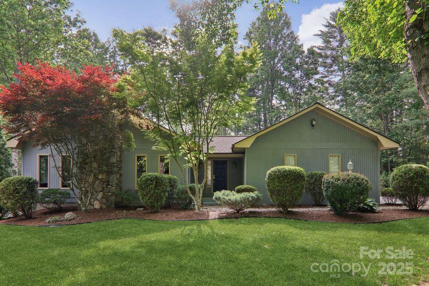 Welcome to this beautifully maintained home, conveniently located just 5 minutes from downtown Hendersonville. Situated in a quiet, no-HOA neighborhood where the street ends in a cul-de-sac, you’ll appreciate the privacy and minimal traffic. Professionally landscaped with lush greenery and seasonal color, the yard offers exceptional curb appeal. The vaulted dining and living areas are anchored by a breathtaking floor to ceiling rock fireplace with gas logs, bringing natural beauty and warmth inside. Step outside to unwind on the expansive deck, great for entertaining. Storage is abundant with easy access to two attics and a full, unfinished basement. Parking is a breeze with a 2-car attached garage, oversized carport, and the large drive-in basement. With updated kitchen appliances, a new water heater, and an HVAC system that was fully replaced in 2016, your move-in ready home awaits you! ***DO NOT USE Princess Ann Drive off Kanuga, use King William Road***