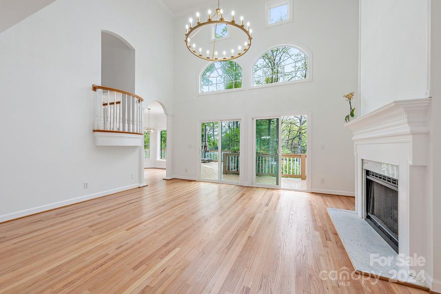 NEW ROOF and AC unit ADDED MAY 2024! PRICED TO SELL AS OWNERS HAVE RELOCATED - LUXURY WATERFRONT HOME UNDER $2MILLION IN CORNELIUS!  Beautiful waterfront home in the highly sought after Waterford Point neighborhood. This sun filled 3,111+/- SqFt custom lake home with approx. 180' shoreline is set back from the cul-de-sac street it is nestled on. Set upon a .7+/- acre lot, a grass and flowering tree-lined driveway leads to this striking home. The epitome of elevated living; this home has plenty of entertaining space, which includes a 2 story great room with an adjoining expansive deck together with a generous sized dining room and eat in kitchen.  This home enjoys a main level master bedroom and ensuite as well as 3 additional large bedrooms and bonus room upstairs. The entertainers yard features cascading gardens, a waterfront gazebo and private dock. Impressively crafted and meticulously maintained. Refinished hardwood floors, new paint throughout, new lighting. LKN lifestyle awaits!