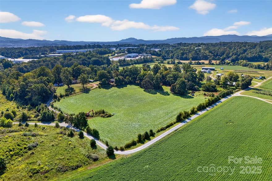 467 Butler Farm Road is 12 acres, surrounded on three sides by over 170 acres of State of North Carolina Horticulture land.  It neighbors multiple Class A industrial properties with companies such as Gaia Herbs, Sierra Nevada Brewing, FedEx, and the Broadpointe Industrial Park.  Located off of the I-26 Airport Road exit, the property is close to The Asheville Airport, and the busy commercial corridor of Airport Road lined with commercial retailers.

Potential uses include Industrial and Multi-family development, homesite with income potential from existing properties, and a family compound.  This is a great property with development potential.

12 acres with 3 houses, barn and workshop. Rolling pasture and amazing views. 
2 pins totaling 12 acres
House 1 - 3/BR 2 bath on partially finished basement additional bath
House 2 - 2BR/1 bath on full unfinished basement
House 3 - 3BR/1 bath on full finished basement w/additional BR and bath

Structures are of value, in good condition, needing minor repair.