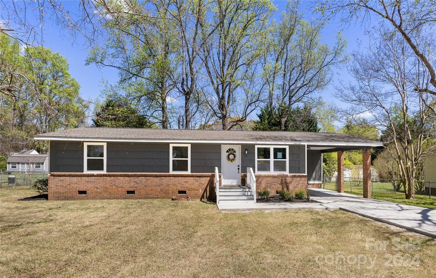Renovated 3 bed/2 bath ranch nestled in the sought-after Lakewood subdivision near Ebenezer Park. Located in a quiet and mature neighborhood, this home offers tranquility and charm. Modern interior featuring new LVP flooring throughout, complemented by fresh paint and stylish, modern light fixtures. The sleek black kitchen cabinets, stainless steel appliances and marble countertops create a sophisticated ambiance, perfect for both everyday living and entertaining. Outside, enjoy the attached carport and a private back porch overlooking the flat lot, ideal for outdoor gatherings or simply relaxing. Schedule a showing today