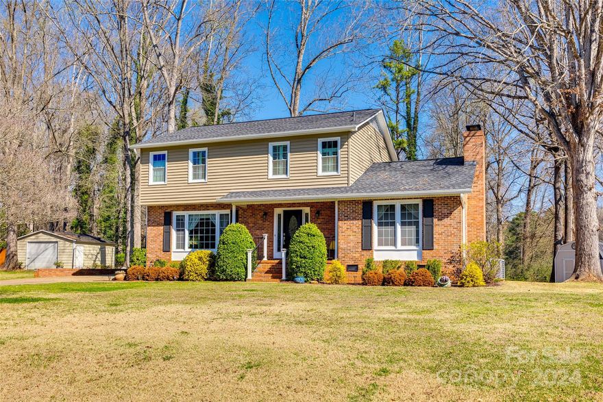 Charming home in one of Rock Hill's establish neighborhoods - Kimberly Woods! Natural light beaming in every room will surely bring you comfort in this home. First floor has 2 large living areas, remodeled kitchen, oversized laundry room, and dining room. Upstairs you will find the primary bedroom suite with walk-in closet and spa like bathroom, 2 additional bedrooms and full bath. Shed and 20x20 workshop with electrical will convey. Enjoy the large backyard with entertaining deck. Location is convenient to interstate 77, restaurants, shops, parks - don't miss this opportunity to make this home yours!