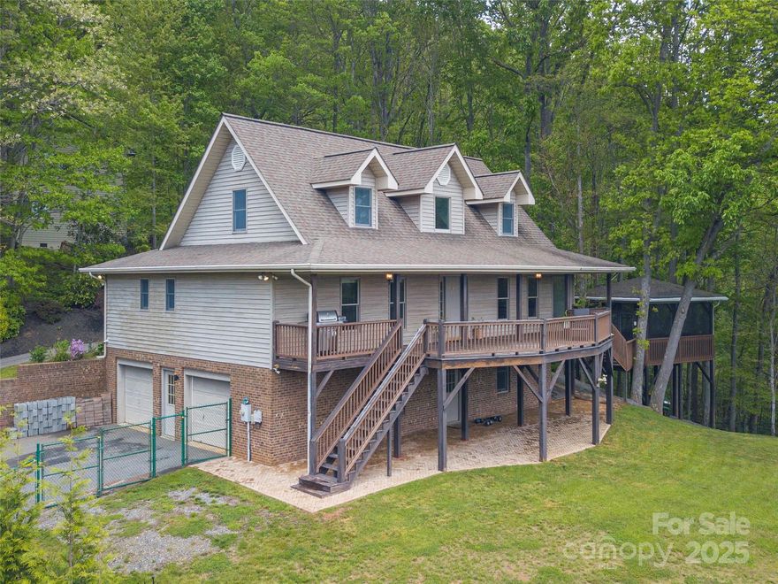 MOTIVATED SELLER! This delightful home boasts breathtaking mountain views and lush, professional landscaping that creates a peaceful, private retreat. Relax in the screened-in gazebo with hot tub, surrounded by trees for ultimate tranquility. Inside, beautiful hardwood floors and abundant natural light fill the space, highlighting the open floor plan. A versatile bonus room, office space, and a partially finished basement offer endless possibilities for work, hobbies, or extra storage. Just minutes from downtown Waynesville’s historic Main Street, this home offers both seclusion and convenience with easy access to all local amenities. Don’t miss your chance to own this stunning mountain oasis!