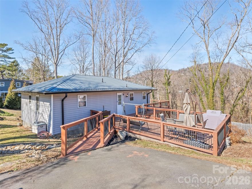 Located in the highly sought-after Beaverdam Road area of North Asheville, this property presents a compelling opportunity for investors or owner-occupants seeking flexible income potential in a premier location. The main level offers three bedrooms and one full bath, while the basement features a finished apartment-style layout with two bonus rooms, full bath, and full kitchen, all with a private exterior entrance. While the basement provides excellent potential for multi-generational living or guest accommodations. Enjoy seasonal mountain views and the long-term value of a North Asheville address, just minutes from Grove Park, downtown Asheville, and UNCA. This home offers a rare chance to secure a property with strong upside and income-producing possibilities in one of the area’s most desirable markets.