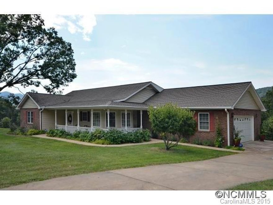 Fantastic long range mountain views from the front and back of this one level home!  Living room with vaulted ceiling, hardwood floors and gas fireplace.  Spacious kitchen with abundant counters, cabinets & natural light.  Owners suite with mountain views, two closets & double vanity. Wonderful outdoor living on screened back porch or open front porch.  Mostly level to gently rolling lawn, and flat driveway with oversize two car garage. Must See!