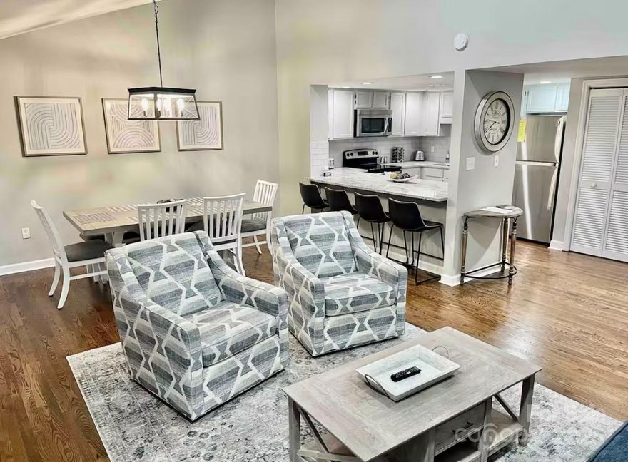 GREAT RENTAL HISTORY on this recently renovated townhome with a bright, modern and open floor plan. Gross rental income was $44,828 in 2023, $42,825 in 2024(Helene shortened season) and $34,827 in 2025 with the lake closed. Expectations are to exceed pre-Helene numbers in 2026 with the opening of the lake! Seasonal peek-a-boo lake views from two private balconies of this luxury 2 BR, 2 BA with a finished lower level. Renovations & updates in 2023 include new hardwood flooring throughout, new kitchen cabinets, granite countertops, new furniture in every room, new bathrooms, all new fixtures and decor. Prime location just a 2 min drive to amenities & restaurants of Rumbling Bald, offering something for all generations to enjoy. Private beach, marina, boat tours, 2 championship mtn golf courses, full-service spa and salon, indoor and outdoor pools, restaurants & bars, tennis/pickleball/basketball courts, miniature golf, boat rentals, etc. Enjoy your mountain retreat without all the maintenance of homeownership. The Quail Cove Townhouses are located behind the gates of the Rumbling Bald on Lake Lure community.