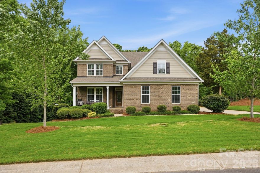 Welcome to this stunning 6-bedroom, 3.5-bath home that truly has the space, layout, and setting today’s buyers are searching for. Every bedroom features its own walk-in closet, giving everyone room to spread out without sacrificing storage. The heart of the home is the gorgeous kitchen, complete with a large island that’s perfect for gathering, entertaining, or everyday living. It opens seamlessly into the main living areas, creating a layout that just makes sense for both busy days and hosting friends and family. The primary suite on the main level offers a private retreat with a tray ceiling, spacious walk-in closet, and an ensuite bath featuring dual vanities, a soaking tub, and separate shower. Upstairs, you’ll find five additional bedrooms, two full bathrooms, and a huge bonus room, perfect for a media room, playroom, or second living space. Step outside and you’ll immediately feel the peace this property offers. Backing up to trees, the covered back porch is the perfect place to start your mornings with a cup of coffee while listening to the birds, or unwind at the end of the day. Home as an irrigation system which keeps your yard looking good with little effort. Located in a sought-after neighborhood with a community pool this home checks all the boxes for space, function, and lifestyle.