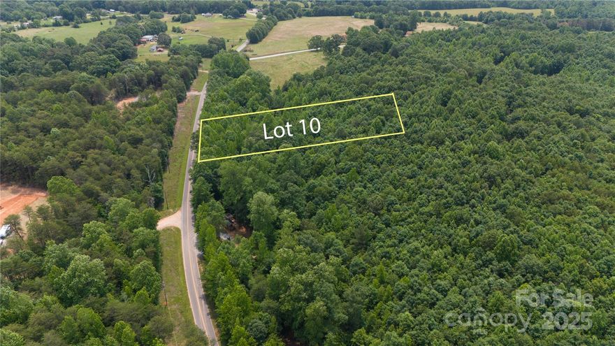 Located in the quiet Creeping Cedar Acres community, this 2-acre lot offers a peaceful setting with room to build. A small creek runs through the property, and a partially cleared homesite is ready for your stick-built home, cabin, or doublewide (singlewides not permitted). The neighborhood has light restrictions to help protect property values while still allowing flexibility. Conveniently situated near the NC/SC state line, it’s just a short drive to Forest City, NC and Chesnee, SC—offering easy access to shopping, dining, and other small-town amenities. Power is nearby, and a well and septic system will be needed. If you’re looking for a property with a bit of privacy, character, and a great location, this one checks a lot of boxes. The adjoining 2-acre lot is also available if you’re looking for additional space