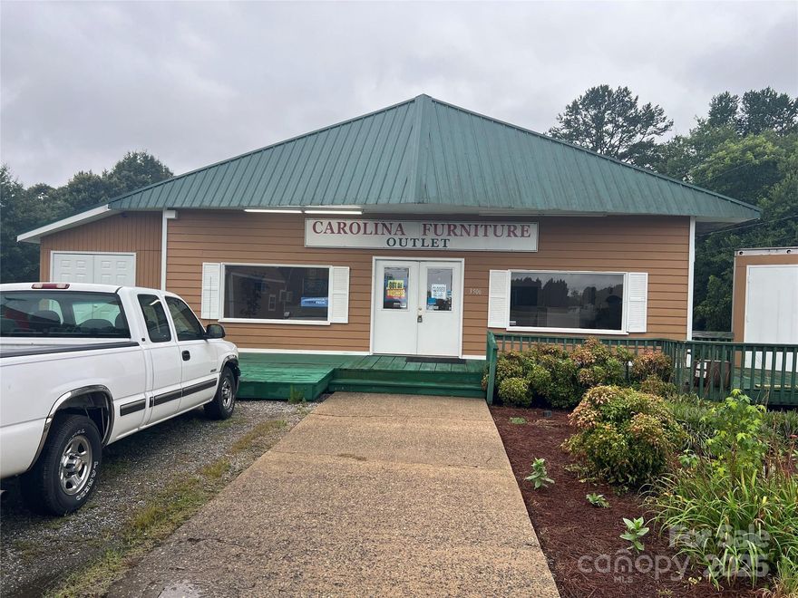 Prime Commercial Opportunity! Located on a high-traffic main roadway in the heart of the county, this property offers exceptional visibility and access. Featuring three separate buildings—a fully operational furniture store, a BBQ drive-thru restaurant, and a versatile storage building—this property is loaded with potential. Whether you're looking to expand your business, open a new retail space, or invest in a multi-use property, the possibilities are endless. Ample parking and strong daily traffic make this an ideal location for a variety of commercial ventures.