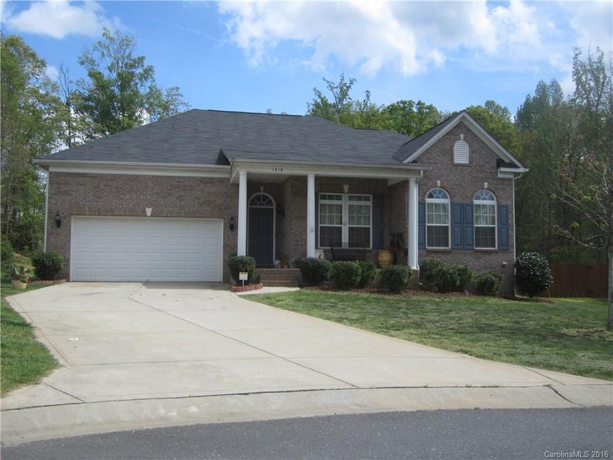 Brick home in excellent nbrhd w wide open floorplan & beautiful hardwood floors. Hi ceilings, granite countertops, tons of kitchen cabinets, formal dining room, sun room, wooden deck overlooking private supersized backyard. Master on the main level along w office and two other bedrooms. Separate living space / home theater or teenager / mother in law suite complete w walk in closet and full bathroom in bonus room. Home located w/in walking distance to new school & on culdesac lot w no traffic.