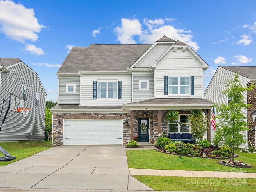Spacious gem offers plenty of flex space adapting effortlessly to your lifestyle needs. Step inside to find updated luxury vinyl plank flooring throughout the main level, illuminated by ample natural light streaming through large windows. Updated light fixtures, quartz countertops and glazed cabinetry throughout the home exude warmth and style.Convenient guest room on main with ensuite bathroom as well as office on main. Entertain or unwind on the extended back patio and enjoy the serene backdrop of lush trees where a retaining wall was added to maximize usability. Or relax on the charming front porch tucked away on a tranquil dead-end road. Two large lofts offer great entertainment and recreational space. Ample storage throughout. This home offers the perfect blend of functionality, aesthetics, abundant natural light, and spacious rooms and closets. Located in the amenity rich community of Walnut Creek. Convenient proximity to all of the upcoming Indian Land growth and downtown Waxhaw
