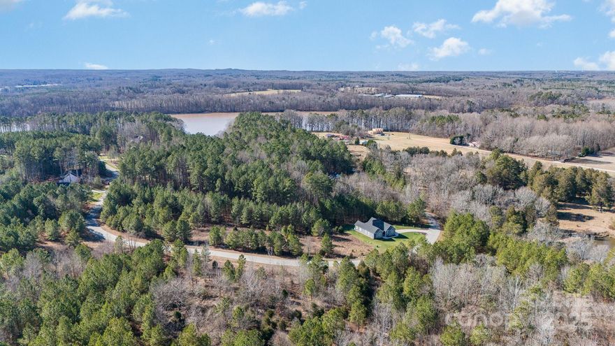 Discover your opportunity to build your dream home in the exclusive gated community of Sunset Pointe on High Rock Lake, NC.  This nearly one-acre homesite offers a rare blend of privacy, natural beauty, and resort style living, all nestled within one of the region's most desirable waterfront communities.  Sunset Pointe offers community boat ramp, clubhouse, outdoor pool, tennis courts, fitness center and a playground.  Bring your own builder and vision to this prime lot, perfectly suited for a custom home.  All plans must be approved by the community's architectural committee. Don't miss this unique opportunity to own in Sunset Pointe, where every day feels like a getaway.