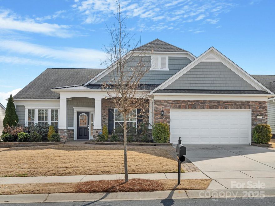 Welcome to the stunning & coveted Morningside Lane floor plan in beautiful Sun City Carolina Lakes! This home features a stone veneer exterior, hardwood floors flowing through the main living areas, newly carpeted bedrooms, & fresh paint. The open floor plan boasts elegant trim work, upgraded fixtures, & a gourmet kitchen w/ walk-in pantry, SS appliances, gas cooktop, wall oven, large prep island, & granite counters. Enjoy your morning coffee or relaxing evenings in the sunroom or screened porch w/ views of the woods & lake. The primary suite offers a large walk-in closet & dual vanities, while two additional bedrooms provide ample space for guests or hobbies. The walk-up attic provides for all your storage needs. Unique upgrades include patio pavers on walkway & front porch, tankless water heater, filtration system, humidifier on HVAC, & built-ins. All appliances convey, including fridge, W/D, & second fridge & freezer in garage. Enjoy resort-style amenities in this vibrant community!