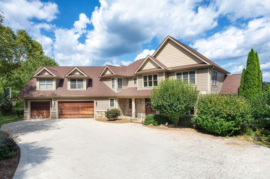 Welcome to Waterford Lakes, one of Fletcher’s most desirable communities, perfectly positioned between Asheville and Hendersonville. This established neighborhood offers a balance of convenience and mountain living, with scenic walking trails, views of the Blue Ridge Mountains, and rolling pastureland with horses in the backdrop. Remodeled in 2019 by Tyner Construction, this spacious home blends modern updates with timeless style. The airy open floor plan features a main-level primary suite with a one of kind custom walk-in closet and spa-like bath. The chef’s kitchen boasts premium appliances, walk-in pantry, stylish finishes, and seamless flow for everyday living and entertaining. Upstairs, you’ll find three spacious bedrooms, three full baths, and a large bonus room ideal for flex space, office, or playroom. The finished basement adds versatility with two bonus rooms, a workout area, a full bath, and an expansive media room with a kitchenette—perfect for multi-generational living or large gatherings. Enjoy outdoor living with multiple decks showcasing stunning mountain views, a sparkling pool, and a fire pit patio designed for fun. A 3-car garage provides ample space for vehicles, storage, and hobbies. City water, no city taxes, and highly regarded school districts (Fairview Elementary, Cane Creek Middle, A.C. Reynolds High) complete the package. Less than 15 miles from Asheville Regional Airport, Mission Hospital, Advent Hospital, Downtown Asheville, Biltmore House, and the Blue Ridge Parkway. Don’t miss this exceptional home offering luxury, comfort, and lifestyle in one of the areas premier communities.