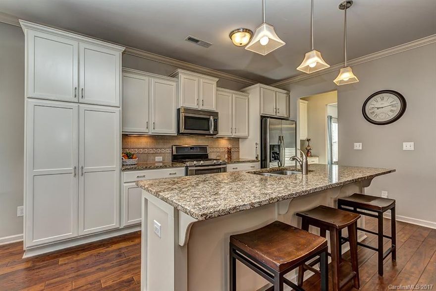 Do you want to live in a waterfront community with great amenities including a championship golf course,
marina, pool, walking trails, tennis and more? Do you want a home in like-new condition with great
features including beautiful hardwoods, gorgeous cabinetry set in a spacious kitchen, a large bonus rooms, and a 3 car garage? Would you enjoy special touches like a butler's pantry, gas log fireplace, &  screened rear patio? If this sounds like you then welcome to Edgewater.