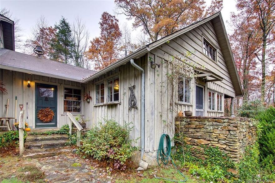 Home has a feeling of old world meets new world ambiance that must be experienced firsthand. Picturesque garden style home located on private wooded acreage.  Vaulted ceilings in the larger living area, wood burning fireplace, ample windows, dinning room, kitchen with kitchen nook for the family to gather in, and beautiful use of wood throughout the home that gives it attractive character. The basement is unfinished but possible room for a workshop and plenty of storage.