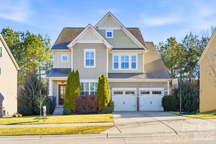 Welcome to 4320 Carrington Drive, an inviting and beautifully upgraded home located within the sought-after Walnut Creek community, ideally positioned just minutes from the highly desirable areas of Indian Land, South Carolina and Waxhaw, North Carolina. This spacious residence offers five bedrooms and 3.5 baths across an open, thoughtfully designed floor plan that blends everyday comfort with refined finishes.

Inside, you’ll immediately notice the elevated details throughout, including high ceilings, crown molding, and custom touches that give the home a polished yet welcoming feel. The main level is designed for both functionality and flow, featuring a formal dining space, a dedicated home office, and a bright living room anchored by a striking stone fireplace. The chef’s kitchen serves as the heart of the home, complete with upgraded appliances, abundant cabinetry, and a large center island with additional storage—ideal for entertaining or casual family gatherings. A guest bedroom with a full bath and a convenient half bath complete the main level.

Upstairs, the home continues to impress with generously sized secondary bedrooms, multiple full baths, a centrally located laundry room, and a truly expansive owner’s suite. The primary retreat features a tray ceiling and a spa-like bathroom with dual vanities, a soaking tub, and a walk-in shower, offering a private escape at the end of the day.

Outdoor living is just as enjoyable, with a large Trex deck overlooking a landscaped, fenced backyard equipped with an in-ground irrigation system—perfect for relaxing, entertaining, or enjoying the peaceful surroundings.

Walnut Creek is a vibrant, amenity-rich community known for its welcoming atmosphere and resort-style features, including a clubhouse, pools, walking trails, playgrounds, and neighborhood events that foster a strong sense of connection. One of its standout advantages is its close proximity to Indian Land, SC and Waxhaw, NC, offering residents quick access to premier shopping, dining, top-rated schools, and charming downtown areas—while still enjoying the space and value of a Lancaster County setting. Convenient access to major roadways also places the Charlotte metropolitan area within easy reach for work or entertainment.

Combining generous living space, custom upgrades, a lifestyle-focused community, and proximity to some of the region’s most sought-after destinations, this home offers an exceptional opportunity to enjoy the best of the Carolinas.