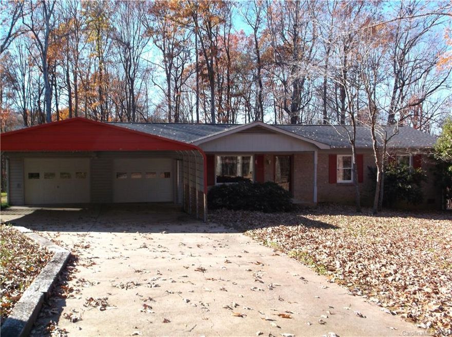 Country Living! One story on wooded lot. All appliances stay washer and dryer included. Kitchen appliances all new whirlpool brand stay. Ceramic tile in kitchen.  Sun room with corner porch.  Two car garage which currently has a walk in dehumidified closet for storage on one side but can be removed.  Across from closet is another small room used for storage. Lots of Storage! Garage walls are covered in peg board excellent for hanging a variety of tools.  Must see to fully appreciate!