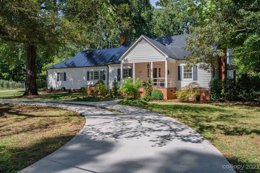 Classic and timeless Davidson home on a truly private .72 acre lot on highly desirable Pine Road.    Equidistant between greenways and downtown Davidson, 445 Pine has been fully restored while maintaining its historic charm.    The circular driveway wraps around a legacy Live Oak tree- transplanted from Wilmington by the original owner in 1974. Modern kitchen opens to dining room, family room and a large screened back porch overlooking heated pool and spa.   Primary suite occupies entire second floor.  With a sitting area, large walk-in closet, lovely cathedral ceiling and immediately adjacent fully climate controlled storage area, the primary has all the character expected of such a unique renovation.   Primary bathroom is large with walk in shower, tub, water closet and dual vanity.   Basement is climate controlled and offers ample storage, large laundry area, and functional utility.  2-car attached garage enters to mud room.