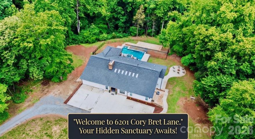 Discover your own hidden sanctuary—you won't believe where this home is sitting! Tucked away in complete privacy with no HOA, this fully updated luxury estate offers the ultimate retreat, ready for your personal touches and immediate move-in. Just minutes from highways, shopping, and dining, the home has been completely reimagined from top to bottom with a dramatic vaulted ceiling and wet bar perfect for entertaining upon entry, expansive living spaces, modern finishes, and effortless flow. The interior has been fully refreshed with new everything: both gourmet kitchens feature quartz counters, custom cabinetry, and islands—the main kitchen is outfitted with two sinks, a pot filler, and a generously sized pantry; all six bedrooms updated with fresh paint, new flooring, and designer lighting; and all six bathrooms upgraded with new fixtures and elegant vanities, including an expansive steam shower in the primary suite. Upstairs awaits a loft area and walk-in attic for storage. The main level includes two expansive living areas providing versatile options for gatherings. Ample storage throughout, plus a basement with rear-facing garage access, keeps everything organized. With six bedrooms (septic approved for four), this property adapts seamlessly to your lifestyle—the basement can be configured as a second living quarters with its own kitchen, laundry room, living room, dining room, and two bedrooms with two full baths. Outside, enjoy an expansive pool surrounded by lush privacy landscaping and a brand-new partially covered back deck that extends your living space outdoors. Recently fully resided and painted in April 2026, with a poured pad awaiting garage completion to finish the circle driveway. Every square foot reflects thoughtful updates for turnkey luxury living. Schedule your private showing today.