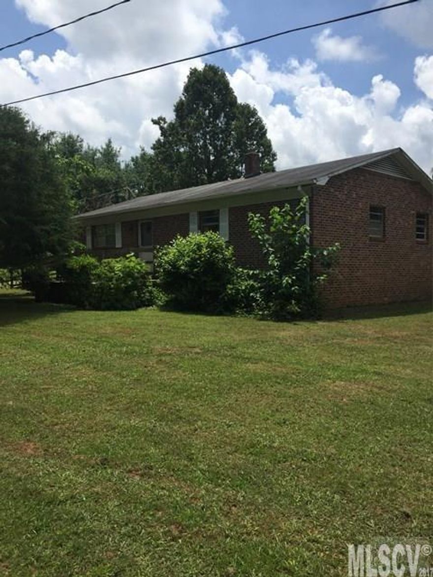 Great investment opportunity in this brick ranch. Located out in the county for privacy but still convenient to interstate 40. Home needs some TLC but has good bones. Two large bedrooms with dining, hall bath, living and kitchen all on one level. Sold AS-IS. Likely will not qualify for loan. Buyer or buyers agent to verify all information.