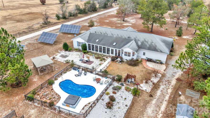 Don’t miss this rare opportunity to own a private 4.2-acre oasis just minutes from downtown Cheraw and bordering the state park! This move-in-ready home is loaded with high-value upgrades and immediate energy savings—fully paid, transferable solar panels (average electric bill only $24/month!), newer roof, newer heat pump, and freshly repaved driveway.
Step inside to a bright, spacious open floor plan featuring 4 bedrooms, a convenient Jack & Jill bath, wide 36” doorways, an oversized walk-in pantry, charming dining-room window seat, and a heated/cooled sunroom that overlooks the sparkling saltwater pool—perfect for year-round enjoyment.
Outside, enjoy irrigated fruit trees and berry bushes, a heated/cooled 2-car garage ready for your workshop, additional storage shed, dry crawlspace with transferable termite bond, and plenty of room to spread out on your own 4.2 acres.
Rare financing incentives available: possible assumable low-rate mortgage AND preferred lender offering additional buydown/closing cost credits—save thousands right now!
Priced to sell FAST and truly turn-key. Schedule your private showing today—this one will be gone before you know it!
1035 McMillan Rd – Your private retreat awaits!