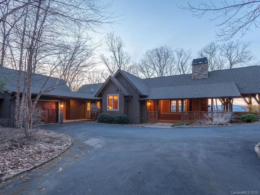 Enjoy gracious one-level living in this open design by Platt Architecture in Mountain Air, with den & two guest suites on lower level. Beautiful wood trim/features, stone fireplace offer rustic sophistication, plus ideally sized custom kitchen w/granite, stainless. Spacious master suite on main level. Outdoor living is easy with screened porch,  wraparound porch w/fireplace, great long-range mountain views. Possible workshop, wine cellar in lower area, plus golf cart garage. Close to amenities.