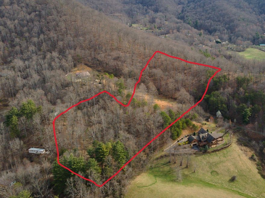 Unrestricted +/-4.5 acres of mountain land, rolling hills and great mountain views, some cleared pasture area, multiple building sites possible, views to nearby lake,  wonderful location-minutes to Downtown Weaverville. 
Portion of PIN#9763-96-3149-00000, deed book/page: 1891/0077, +/-4.5 acres to be surveyed off of larger tract prior to closing.