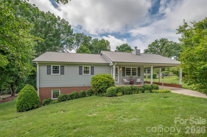 Welcome home to this well-maintained and move-in ready 3 BR, 2.5 bath home offering comfort, space and plenty of storage. Upgrades in 2017 include steel siding, metal roof and heat pump. This home is built for low-mainenance living and lasting value. Inside you will find a nice layout, living room with a wood burning insert, kitchen/dining area with upgraded glass doors leading to a large deck, beautiful wood floors, full heated basement with half being finished with beautiful large den with gas log fireplace and half bath and access to beautiful patio and pergola, the other half (partially finished) offers craft room, loads of storage and laundry. The covered front porch and attached carport provide great curb appeal and a relaxing place to enjoy the outside. Outside is where this property truly shines! In addition to the detached double-car garage/workshop, there are several additional outbuildings ideal for storage, hobbies or equipment. Plenty of room for tools, toys and projects! Beautiful yard and grass, peaceful setting and ready for its next owners. Don't miss this great opportunity!
