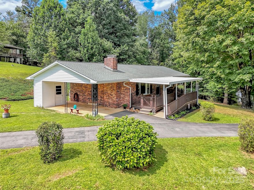 Welcome to this beautifully maintained brick ranch on 1 acre, offering peaceful mountain living with breathtaking views of the mountains and valley below. Thoughtfully cared for and full of charm, this home features a full, partially finished basement—providing endless potential for additional living space, a workshop, office, recreation room, or guest suite. Step onto the spacious covered deck and take in the cooler mountain temperatures, fresh air, and sweeping natural scenery. Whether you're relaxing with morning coffee or entertaining friends at sunset, this outdoor space is truly an extension of the home — a private retreat surrounded by nature. Inside, you’ll find a warm and inviting interior complete with a gas-log fireplace, ideal for cozy evenings, and hardwood flooring under most carpets, already revealed in one bedroom and the rest could be exposed just as easily. The layout offers comfortable living with classic brick-ranch durability and charm. Located in a quiet, established area, this property offers the rare balance of tranquility and convenience. From your front door, a short walk leads directly into National Forest land, where you can enjoy miles of hiking, biking, and horse trails — an outdoor lover’s dream. Despite the peaceful setting, you’re still just a very easy commute to Asheville, grocery stores, restaurants, and all the amenities of town. Whether you're searching for your forever home, a mountain getaway, or a property with room to expand and make your own, this home delivers comfort, convenience, nature, and unbeatable views all in one place.