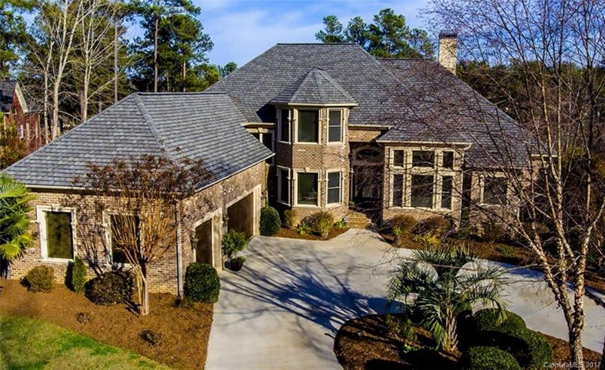 Beautiful Lake Wylie custom home on 1.07 acres & deep water! 4 bd/4 & 2-1/2 bath, foyer, beautiful kitchen, 2 story living area w/Travertine Stone. 3 balconies, 2 patios & porch. Lower level has lrg entertainment area, bar & exercise room. Extremely large storage area. Outdoor area has large back yard. Boat lift. 189 linear ft of water front. 3+ car garage, manicured landscaping w/irrigation. 5823 HLA. 29 miles from Uptown Charlotte 26 miles from Clt airport. Low taxes & excellent Clover schools
