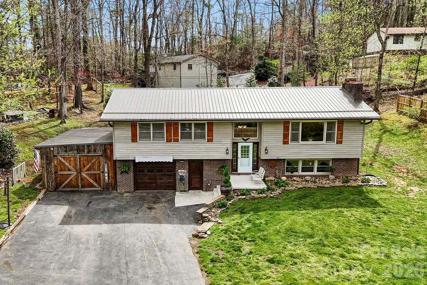 Welcome home to the space you’ve been looking for. Tucked away in Etowah, this 3-bedroom, 3-bath split-level home offers the kind of flexibility that’s hard to find, with a layout that truly adapts to your lifestyle. The main level is bright, comfortable, and easy to live in, while the fully finished lower level creates a completely separate living area with a bonus room and full bath—perfect for a guest suite, working from home, or multigenerational living.

The setting is just as appealing and incredibly convenient to town. Situated on a level 0.41-acre lot, you’ll have space to enjoy the outdoors without sacrificing privacy. An attached garage and workshop add even more function, giving you room for hobbies, storage, or weekend projects.

And when it comes to location, you’re exactly where you want to be—close enough to everything, yet far enough to enjoy the calm. You’re just minutes from the Ecusta Trail and approximately 25 minutes to Asheville, 15 minutes to Hendersonville, 20 minutes to Mills River, and about 20 minutes to Asheville Regional Airport—making everyday life and weekend plans easy.

If you’ve been searching for a home that offers space, flexibility, and a great setting all in one—this is your opportunity. Come see it for yourself!