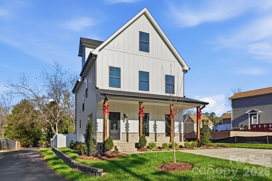A Storybook Luxury Residence Steps from Historic Downtown Waxhaw. Welcome home to 411 Brevard St. This exceptional residence blends artisanal craftsmanship with refined modern living. Every detail has been curated for the discerning homeowner who values design, comfort, and timeless sophistication.  A welcoming front porch sets the tone for the home’s charm, while the fully fenced backyard and complete irrigation system enhance its effortless livability. Constructed with enduring quality—fiber-cement siding, a 30-year architectural roof, and 6-inch gutters—the home promises both beauty and resilience. Inside, stunning white oak hardwood floors flow seamlessly through the main living spaces, creating a warm yet elevated aesthetic. The ambiance is enriched by Sherwin-Williams designer neutrals, porcelain-tiled baths. At the heart of the home lies a chef-inspired kitchen featuring a KitchenAid Elite Series suite, including a double oven, smooth 5-burner cooktop, end-cabinet microwave, and dishwasher. A generous kitchen island and premium quartz countertops complete this sophisticated culinary space.
Exceptional energy efficiency is achieved through insulated Low-E vinyl-clad American Standard windows and an 18-SEER heat pump with split zoning, ensuring year-round comfort across all levels. The dedicated laundry room with custom folding station enhances both convenience and organization.
The primary suite is a serene retreat, highlighted by a tray ceiling, a spa-quality bath with LED-lighted dual vanity mirrors, a porcelain floor-to-ceiling tiled shower, and a separate soaking tub that invites relaxation. 
A coveted third-floor bonus level, complete with a full bathroom, offers versatile space for a private guest suite, executive office, media room, or fitness studio—tailored to fit any lifestyle.
This captivating Waxhaw residence delivers an unmatched blend of luxury, walkability, and architectural integrity. It is more than a home—it's an experience, a sanctuary, and a rare opportunity to live immersed in charm and elegance just moments from Waxhaws' restaurants, boutiques, breweries, cremeries, coffee houses and more.
