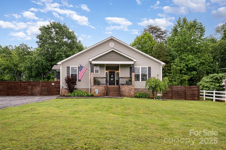 Welcome to this gorgeous custom-built home, featuring a charming rocking chair front porch and a spacious, private backyard lined with mature trees, offering a serene outdoor retreat.
Come inside to an inviting open-concept living space with hardwood floors, vaulted ceilings, and an abundance of natural light. The kitchen is a chef’s dream, equipped with granite countertops, a stylish tile backsplash, ample cabinet space, a pantry, and stainless steel appliances, including a double oven and pot filler. 
The generous primary suite has double closets, featuring custom-built-ins for optimal organization. There’s also approximately 500 square feet of attic storage space. And a flex room that can be used as an additional bedroom or office. A chicken coop (with chickens!) and an above-ground pool can convey with the property, or the sellers are happy to remove them at the buyer’s request. Conveniently located close to schools and only 15 minutes from Hickory.