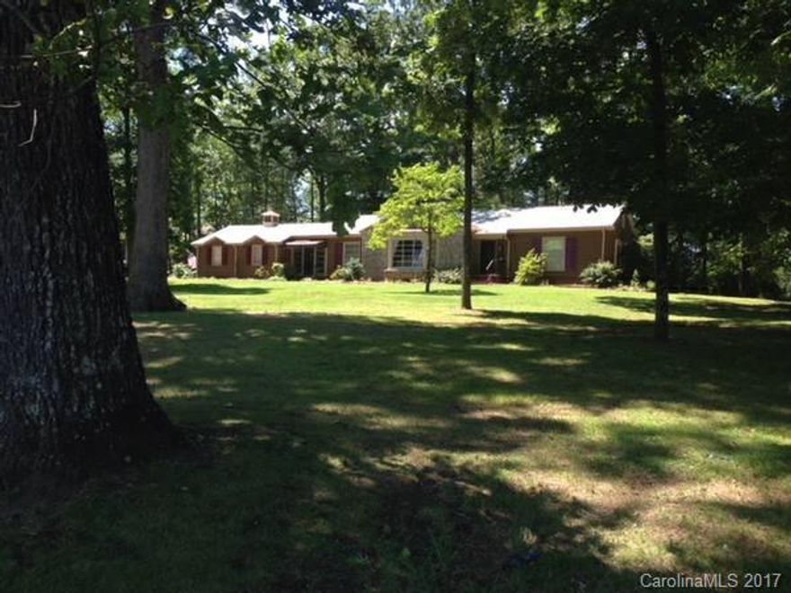 Owner relocation is your lucky break!Many updates to this classic ranch-new kit cabs,countertops & flooring,new DW,W&D,new tankless WH,fresh int & ext paint,upgraded elect service & breaker panel,new ADT,much more.3BR,1 1/2BA,hardwood floors,wood burning FP,att 2car gar.Stone patio is perfect for fall cook-outs.Home sells fully furnished & inc new JD mower & util trailer & more.Convenient location is less than 1/2 mile to Hwy 74 for easy drive to Charlotte, Asheville & everywhere you want to go!