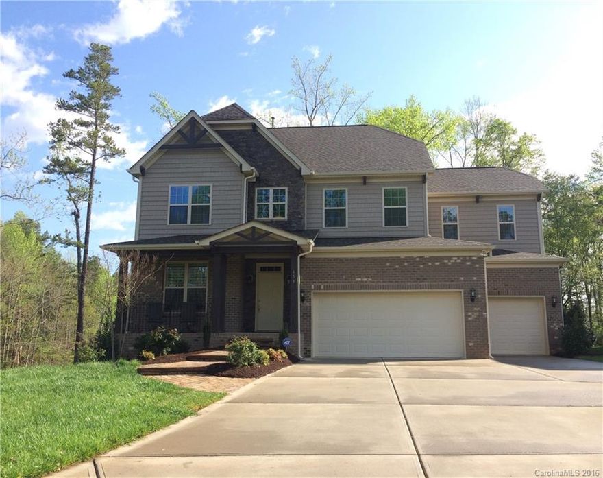 Beautiful brick home on private wooded lot with view of water! This 4BR/3.5BA home includes a stunning master retreat w/FP, guest suite w/bath, study/office & large ready-to-finish walkout basement. Hardwood floors, SS appliances & granite counters thru-out. Living room w/stone FP & open floorplan. Walking distance to community amenities: pool, clubhouse, recreation area & playground. Over $15k in upgrades including plantation shutters, irrigation, fenced yard, alarm system & more!