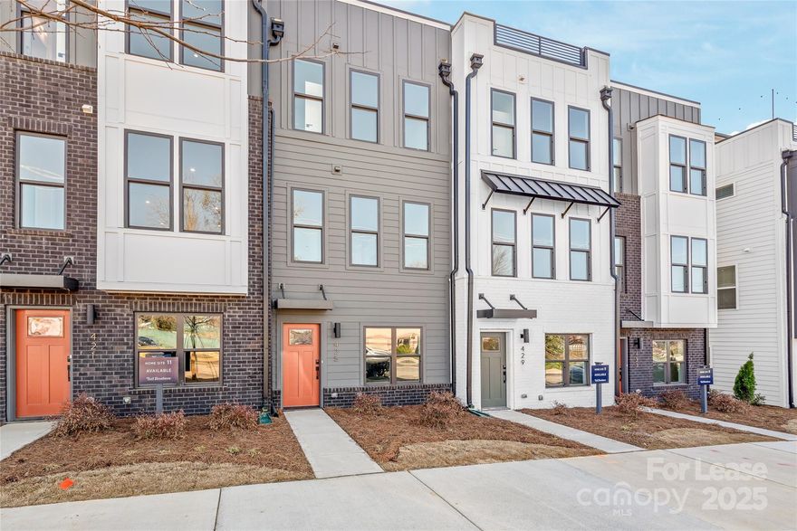 Experience modern urban living at its finest with this spacious 4-story townhome, ideally located in LoSo, just minutes from South End. This exclusive property offers a stunning multi-level layout with beautiful flooring, expansive windows, elegant moldings, and designer touches. The open-concept living and dining areas flow seamlessly to a private balcony, creating an ideal space for entertaining. The kitchen blends style and functionality, featuring shaker-style cabinets, quartz countertops, a large island, and high-end stainless steel appliances, including a gas range. The third floor hosts two luxurious primary bedrooms, each with tiled showers, dual vanities, and spacious walk-in closets. The top floor offers a third bedroom with an en-suite bath, plus a loft bonus room that leads to a rooftop terrace with city views. Additional amenities include a 2-car tandem garage and stackable washer/dryer. Enjoy easy access to shopping, dining, breweries, and I-77 in this prime location.