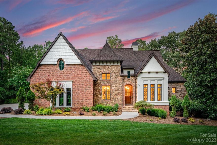 Secluded waterfront estate nestled on 4.73 acres in The Sanctuary @ Lake Wylie offers nothing short of splendor & luxury. This incredible waterfront custom two level home offers 5 bdrms & 4 full baths encompassing designer details throughout. Chefs dream gourmet kitchen boasts Wolf/Subzero appliances, gorgeous glazed cabinetry, butler pantry, w/ wet bar, stately dining room with cathedral ceiling, exposed wood beams & light filled breakfast area with access to outdoor screened veranda. Main living area features spacious primary suite, tranquil primary en-suite, wood beamed great room, formal study/flex space & private guest suite. Lower level awaits with family room, billiard, wine cellar, 2 more bedroom suites and state of the art theater. Walk out to covered patio to take in views of woods and lake or cozy up next to grand stone fireplace. Travel down the wooded path to your pier and boat slip. Lake, luxury and laid back living all within one property! Look no further!