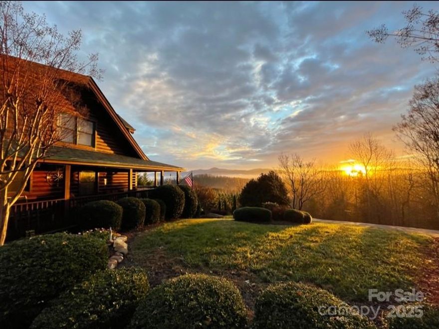 Enjoy the peace and tranquility of this stunning mountain top retreat. The spectacular views are truly breathtaking. There are year round views of Grandfather Mountain, Pilot Mountain and all the surrounding Blue Ridge Mountains. The morning sunrises and evening sunsets can be viewed from the wraparound covered porches and decks. The 2.29 acres are beautifully landscaped with flowering plants and trees. Upon entering this custom log cabin it is evident this is a one of a kind cabin and location. It is tastefully decorated and immaculately maintained. There is plenty of room for friends and large family gatherings. Above the detached garage is a full apartment with it's own kitchen , fireplace and deck.  If you have been wanting a NC mountain top property this is it! The Hidden Lake community features a pool and jetted spa, a fishing and paddling lake ,  hiking trails and a creekside park. Only 9 miles to I-40 but a world away. Make your NC mountain dreams come true.