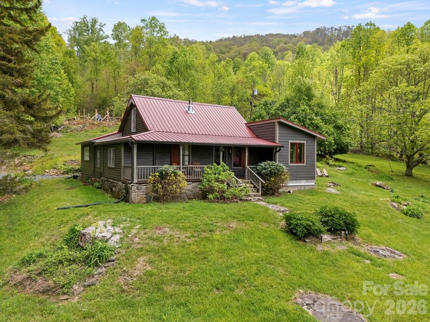 Tucked into the serene mountain landscape of Bakersville, this inviting property offers the perfect blend of privacy, natural beauty, and functional living. Surrounded by mature trees and peaceful surroundings, 1108 Pine Root Branch Rd delivers a true retreat feel while still providing access to everyday conveniences.

Inside, you’ll find a comfortable and well-laid-out interior designed for both everyday living and relaxation. Natural light flows throughout the home, highlighting the warm finishes and creating an inviting atmosphere. The living spaces are ideal for gathering, while the kitchen provides ample room for cooking and entertaining.

Step outside and enjoy the expansive outdoor setting, perfect for morning coffee, evening unwinding, or hosting guests. Whether you're looking for a full-time residence, a mountain getaway, or an investment opportunity, this property offers versatility and charm.

The barn offers endless potential as well. It is currently configured with a workshop on the main level and an upper-level unfinished living space with a bedroom and bathroom. This additional area presents numerous possibilities for customization and use!

With its peaceful setting, usable space, and classic mountain appeal, this home is a must-see for buyers seeking both comfort and escape.
