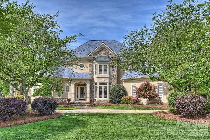 PERFECTION IN PIPER GLEN! This stunning Simonini custom stucco home offers one of the most breathtaking views in the neighborhood, backing to a picturesque par-3 water hole with sweeping views of the 8th green and tranquil pond. Elegant formal living and dining rooms set a refined tone upon entry. The chef’s kitchen is designed to impress, featuring Viking stainless steel appliances including 6-burner gas cooktop and double convection wall ovens, granite countertops and glass tile backsplash, a center island, breakfast bar, walk-in pantry and abundant cabinetry. The kitchen flows seamlessly into a sun-filled breakfast area and an inviting great room complete with an impressive quartz stone fireplace with gas logs and custom built-in cabinetry with a wine cooler and wet bar - ideal for both everyday living and entertaining. The main-level owner’s suite is a private retreat with tray ceiling and spa-inspired bath showcasing a soaking tub, oversized tile shower, dual vanities, and a spacious walk-in closet with an additional cedar closet tucked beneath the staircase. Upstairs offers exceptional flexibility with three additional ensuite bedrooms, two oversized bonus spaces, plus a versatile enclave perfect for a home office, playroom, fitness space, or climate-controlled storage. Step outside to an expansive deck with hot tub and multiple seating areas that overlook the golf course, lushly landscaped park-like backyard, and water views - a serene setting for morning coffee or gorgeous sunset gatherings. An oversized garage provides workshop space, abundant storage. The circle driveway provides a welcoming gracious entry as well as ample parking. Ideally located near Piper Glen shops, Trader Joe’s, Starbucks, Stonecrest, McAlpine Greenway, I-485, and Charlotte Douglass International Airport. Excellent South Charlotte schools including the brand new highly anticipated Ballantyne Ridge High School. Optional memberships at TPC Piper Glen Country Club are available. Information available upon request. Experience luxury, location, and lifestyle -  Welcome Home.