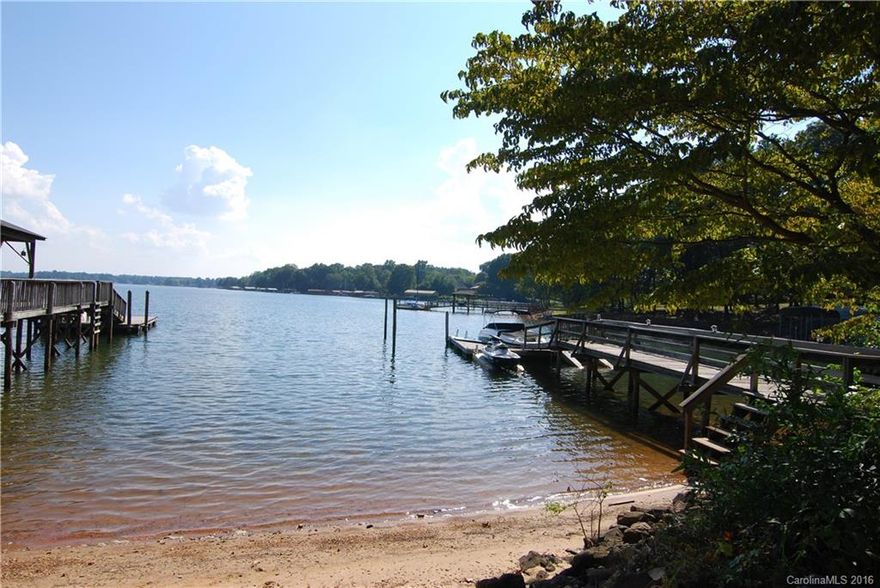 A BIG price reduction of $21,000 and the amazing waterfront views over Lake Norman w/ deep water at the pier, this offers just the right amount of space without being too large, North Lincoln Schools on a private driveway in the heart of Denver NC this home offers a fully fenced yard, a gentle slope to the water, lake fed irrigation, and true long range views over the glistening waters of the lake. Don't miss this one.  Sit on the deck and enjoy the scenery and welcome to Lake Norman Lifestyle!
