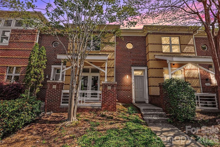 Welcome to 703 E 8th St - Exceptional INVESTMENT opportunity in the heart of First Ward—this beautiful townhome is being sold FULLY FURNISHED, making it truly turnkey. Ideally located in Uptown Charlotte, just steps from top dining, parks, nightlife, and premier sports and entertainment venues including Panthers Stadium, Nights Stadium and Blumenthal Performing Arts. Currently a successful AirB&B. Featuring 3 bedroom and 2.5 bathrooms.  This light-filled home features an open-concept layout with abundant natural light. Designed for both entertaining and everyday living, the space offers a stylish European flair, and seamless flow between living, dining, and kitchen areas. 9-foot ceilings on the main level creates an airy, spacious feel.  Functional kitchen with breakfast bar. Enjoy private outdoor spaces including an enclosed courtyard and nice front porch with a great view of the city skyline.  The second-floor primary suite boasts exceptional natural light and view of the City, plus a spacious walk-in closet. Whether hosting friends for game day, enjoying a night out at the symphony or ballet, or simply taking in the city views, this home offers the ultimate Uptown lifestyle. Ideal for investors, second-home buyers, or those seeking a fully furnished move-in-ready property.