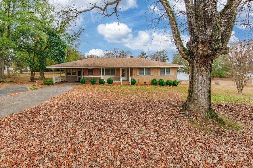 Charming brick ranch with 3 bedrooms and 2 full baths. This property also includes a separate building featuring a spacious mother-in-law suite with its own bedroom, full bath, and built-in shelving—perfect for guests or extended family. A detached garage adds extra functionality and storage.  This home provides a great country setting close to town.