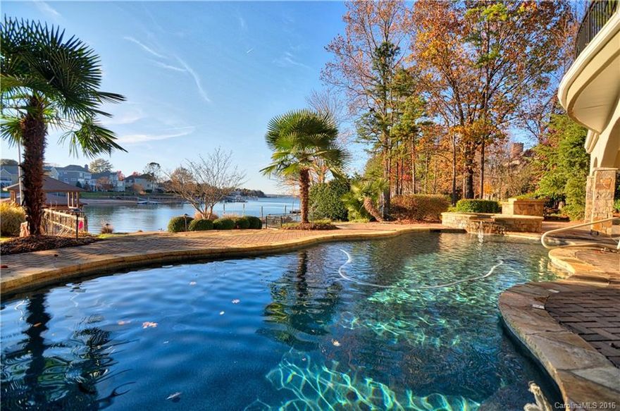 Stunning waterfront home in desirable Peninsula neighborhood.Amazing 2story great room w/panoramic views.Gourmet kitchen w/SS appliances, island & granite countertops.Elegant master retreat w/walk-out to screened porch.Huge basement w/built-in bar & beautiful fireplace perfect for entertaining.Wonderful outdoor oasis w/resort like saltwater pool,spa,outdoor kitchen,fireplace & covered patio.Private pier w/boat slip & sitting area perfect for relaxing while enjoying the view on the quiet cove.
