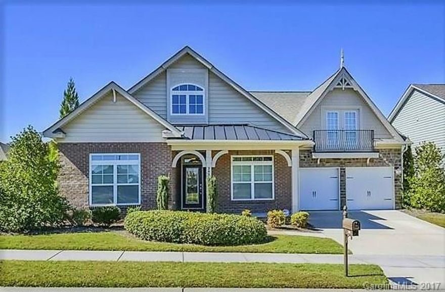 Gorgeous modern home features large family room w/ tray ceilings, fireplace, bright floor-length windows & breakfast nook; opens to stone patio w/ outdoor fireplace & water feature, formal dining room w/ charming tile & wood inlay, study w/ built in shelving, Master BR w/ bay window, walk-in closets, garden tub & water closet; upstairs BR/bonus room w/ full BA; kitchen features bar, cherry cabinetry & stainless appliances; access to state of the art club house, pool, fitness center & playground