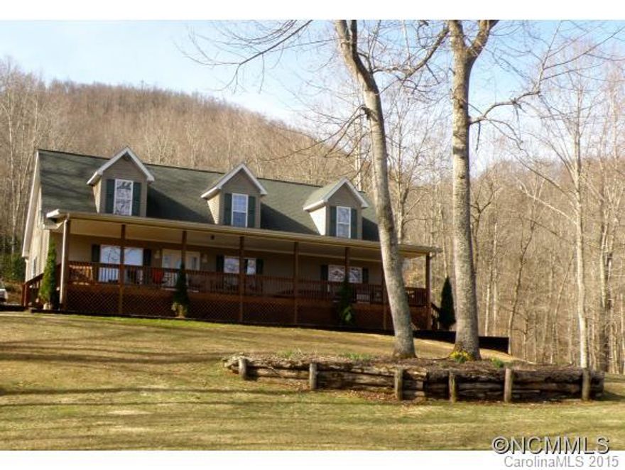 PRIVACY!  VIEWS!  Come sit and relax in the covered hot tub on the front porch while enjoying the majestic mountains in your view.  MBR has tray ceilings and garden tub in bath, beautiful rock FP in LR,  3/2 on main level with bath and 4th bedroom on top floor with massive game room,  Outbuilding, dog lot, tree house, and beautiful landscaped yard, Cape Cod design offers peace, privacy, and tranquility with massive views.