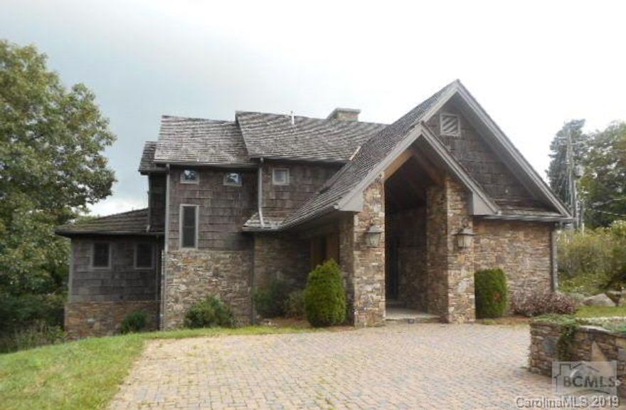 Enjoy spectacular layered mountain views of the gorge to the south and Grandfather Mountain to the west from this bark and stone home within walking distance of downtown Blowing Rock. Views can be seen from almost every room. Gourmet kitchen with island, double oven, 6 burner gas range, pot filler, warming drawers, and ice maker. Master bedroom suite has stone fireplace, private balcony, and large bath. Lower level features den with fireplace, bedroom 5, and a full bath. Elevator available on all 3 floors. See attachment for PAS requirements and WFHM offer submittal information in MLS document section. No electronic signatures.