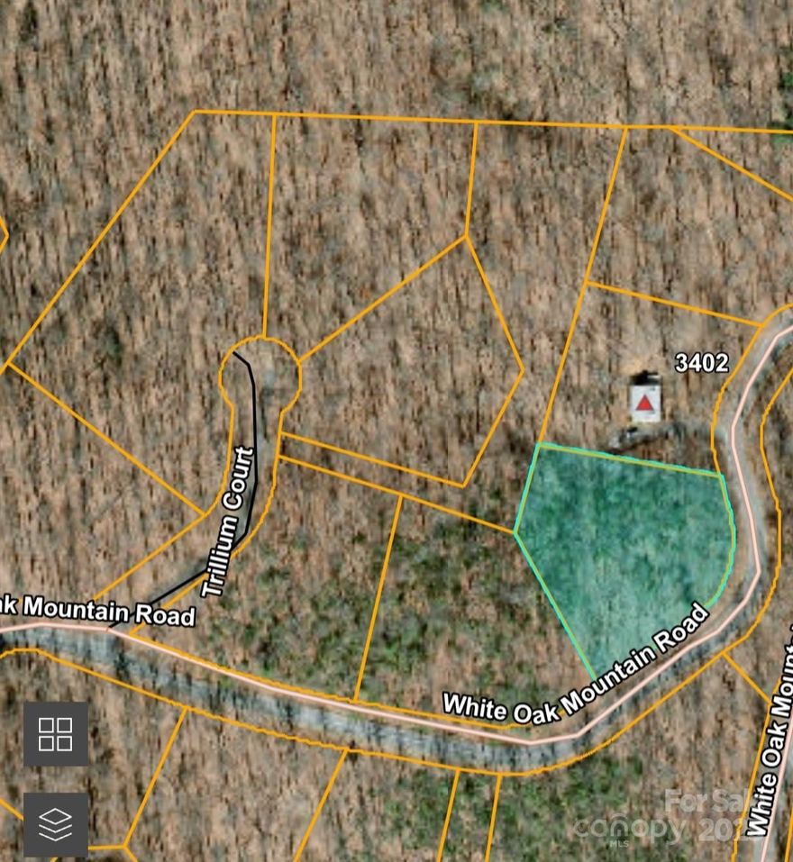 Privately located on the backside of White Oak Mountain - this 1+ acre lot sits high on a ridge and provides a nice building site for a private, secluded home!  Lot is one of 5 for sale in a row along White Oak Mountain Rd. - this is a good opportunity to buy a couple lots to insure extra privacy!  White Oak Mountain is located in Columbus, NC and offers a peaceful & quiet location to live, abounding with wildlife, scenic ponds, trails, and more.  White Oak is where Blue Ridge got their beginning back in the 80's, developing log cabins on the mountain. While the Mountain attracts many full time residents, it is still a very popular getaway location today... for 2nd homes & retirees!  The Association offers fishing ponds, picnic areas, a pavilion for residents to use, and walking trails. The association has a very informative website. Restrictions apply - no manufactured homes, HOA Dues, etc.