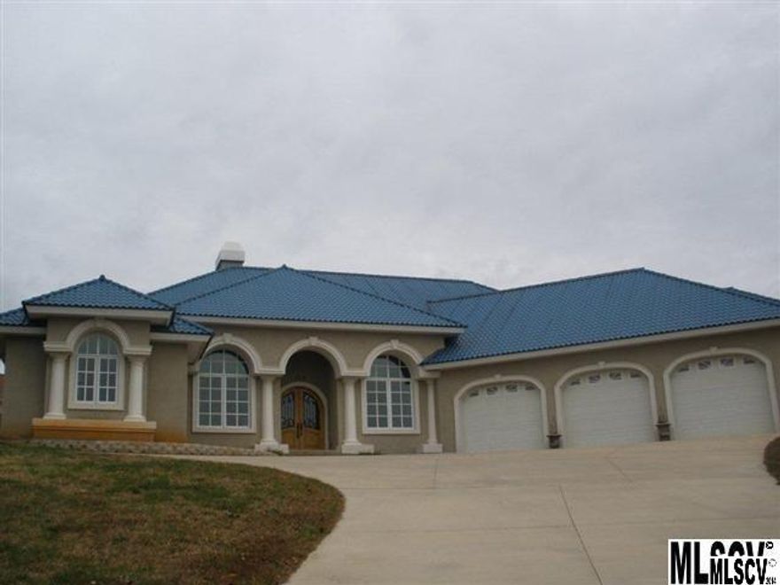 Incredible views from this three bedroom, 2.5 bath, triple car Mediterranean style home overlooking Lake Hickory! Areas perfect for formal & informal entertaining.  Gourmet kitchen that includes: granite countertops, large prep island, professional gas stove & wall oven, refrigerator, walk-in pantry and wine cooler all making this kitchen a chef's delight. French doors from various rooms overlook the in-ground pool. Covered porch and patio area. Home has three fireplaces, wine room, billiard room, huge master and a media room. Italian tiles on floor and baths, barrel ceilings, beautiful light fixtures and lots of storage make this home a must see. Oversized 3-car garage. Motivated Sellers!