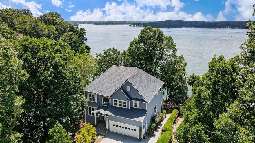 Welcome to this incredible lakefront property in Tega Cay, boasting panoramic views of the main channel of Lake Wylie. Located on an expansive level lot, the home offers an exceptional opportunity to transform it into your dream waterfront retreat.Features updated windows, fresh paint, & new roof. Its functional floor plan is ready for your personal touch, promising to turn the property into a show-stopping escape. Enjoy stunning sunsets, tucked far enough to offer protection from the bustling boat traffic of the open water.The property ensures a private, tranquil setting while offering the vibrant Tega Cay vacation lifestyle. Enjoy access to a variety of amenities, including a marina, golf course, walking trails, & parks. In addition, the property falls under the highly-rated Fort Mill School district.Experience life on the lake in this one-of-a-kind property. Don't miss this opportunity to bring your vision to life in a prime location. Embrace lakeside living at its best. Hurry Home!